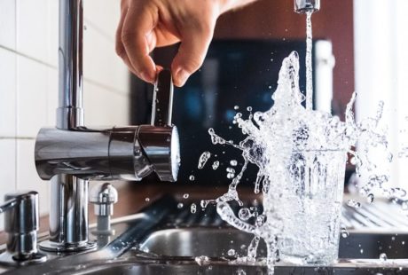 person opening faucet